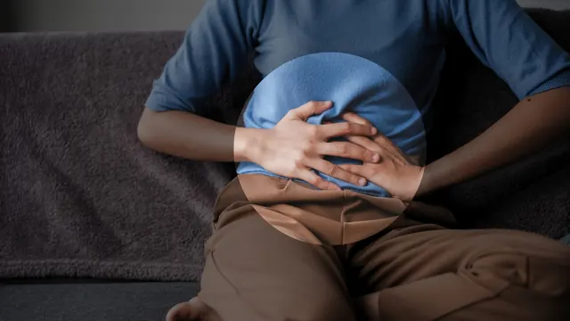 A person holding their stomach